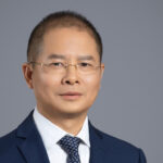 Article illustration of Eric Xu of Huawei. Article concerns new Ascend chip range from the company.