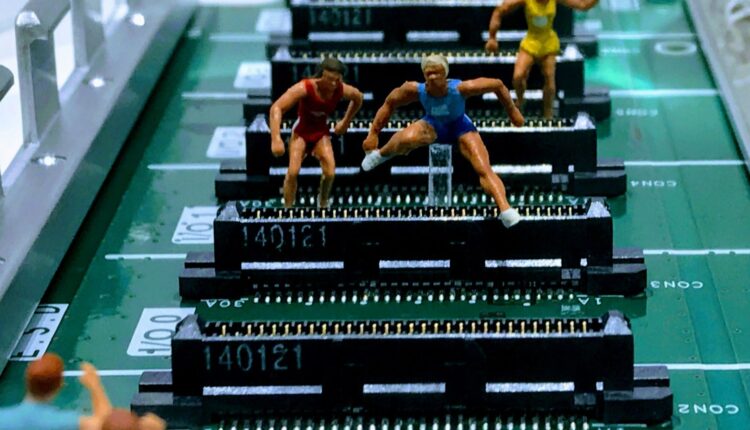 Figures hurdling on a computer board as while politicians tout AI’s promise of growth and efficiency, a new report reveals a public trust deficit in the technology.