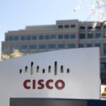 "San Jose, United States - February 11, 2013: A large Cisco Systems sign sits outside their headquarters located at 400 Tasman Dr. in San Jose California. Cisco Systems is a multinational company that produces computer networking equipment."