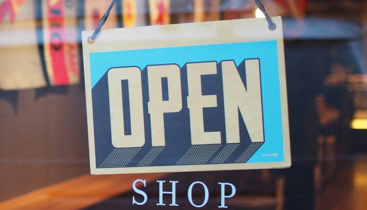 Open shop sign in a store as SAP and Google Cloud are deploying agentic commerce architecture to automate multi-agent marketing and retail operations at enterprise scale.